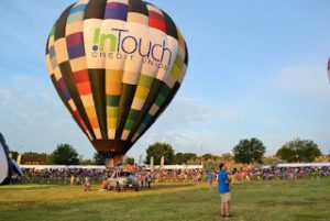 InTouch Credit Union hot air balloon on the launch field.
