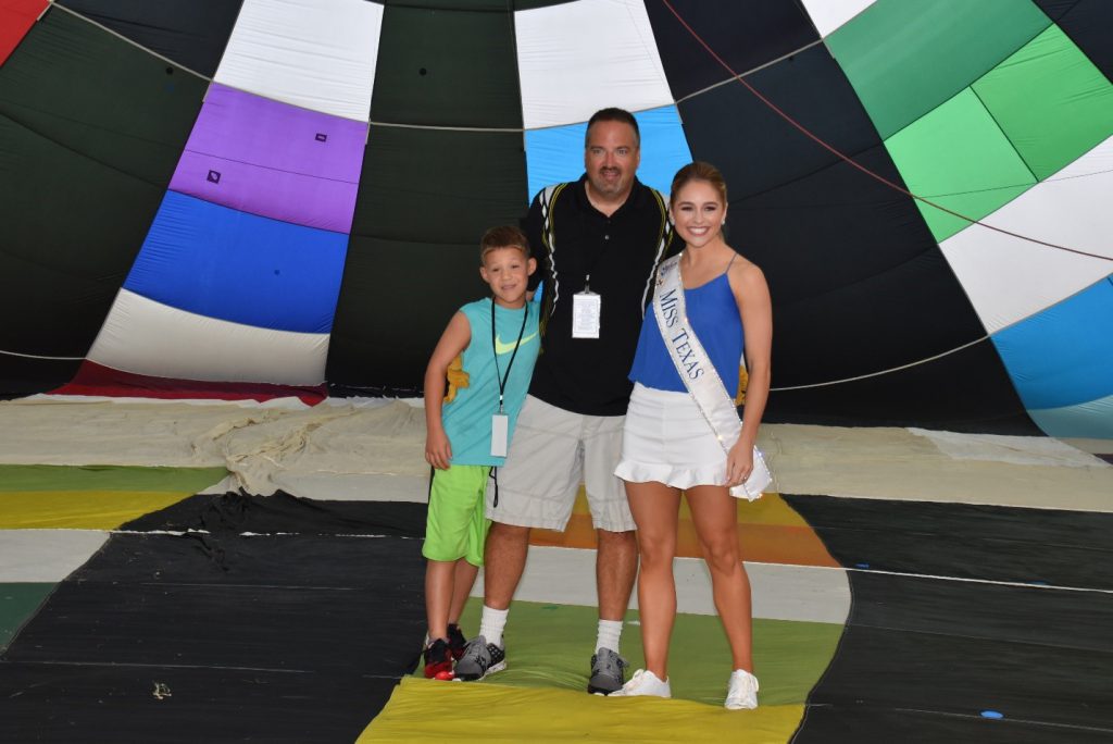Scott Vesely with Miss Texas inside his hot air balloon at the 2017 InTouch Credit Union Plano Balloon Festival.